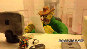 Claymation character, Billy, looking at a paper at his desk, with the caption, "Trying to create good work habits for creating jokes about my bad work habits."