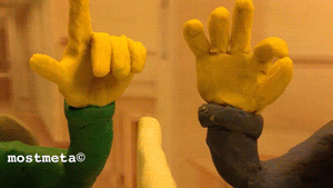 Two claymation characters engaging in a special handshake. One makes a pointed finger. The other makes an O-K sigh. The finger guy places his finger in the O-K hole.